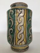 A Continental pottery drug jar decorated with brow