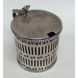 A Georgian silver pierced mustard with hinged top.