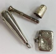 A silver engraved vesta case together with a cigar