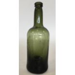 An early 19th Century green glass wine bottle. App