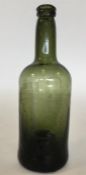 An early 19th Century green glass wine bottle. App