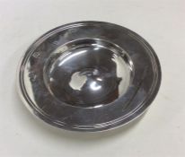 A circular silver Armada dish with reeded decorati