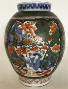 An Imari oviform porcelain vase over-painted with s