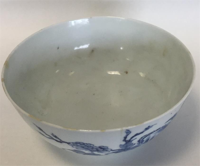 A Chinese porcelain blue and white bowl painted with flowering - Image 2 of 3