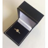 A gold and diamond single stone ring in 18 carat p