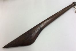 A carved tribal spear etched with stars. Approx. 5