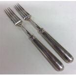 A pair of Georgian silver reeded forks of tapering