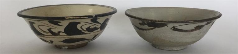 A Chinese Cizhou pottery bowl painted in dark and