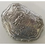 A 19th Century French silver snuff box heavily dec