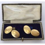 A good pair of heavy plain 18 carat oval cufflinks