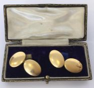 A good pair of heavy plain 18 carat oval cufflinks