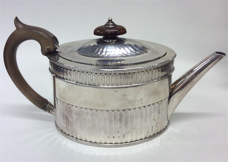 A good Georgian silver teapot with half fluted bod - Image 2 of 3