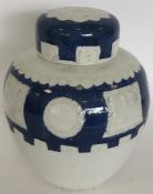 A pottery blue and white oviform vase and cover mo