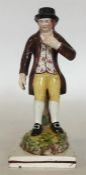 An Enoch Wood Staffordshire figure modelled as a ma