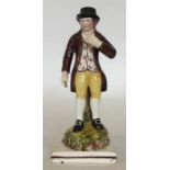 An Enoch Wood Staffordshire figure modelled as a ma