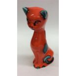 A bright orange and green porcelain seated cat. Ap