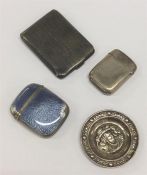 A silver engine turned match case together with a