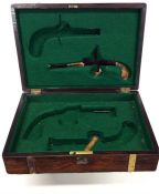 A mahogany box fitted for duelling pistols with br