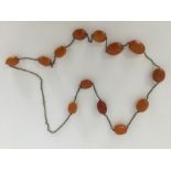 A graduated string of amber beads. Approx. 82 gram