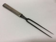 YORK: An unusual silver carving fork with steel bl