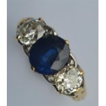 An 18 carat sapphire and diamond three stone ring