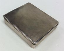 A good quality engine turned silver box with hinged cover