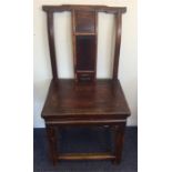 A Chinese hardwood hall chair with stretcher base.