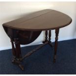 A good mahogany Sutherland table with turned suppo