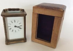 A good brass carriage clock in travelling case com