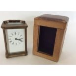 A good brass carriage clock in travelling case com