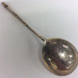 A Russian silver gilt spoon decorated with flowers