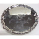 A George III silver crested salver with gadroon ri