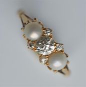 An attractive pearl and diamond seven stone ring i