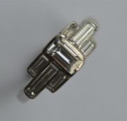 An Art Deco platinum and diamond ring, the large c