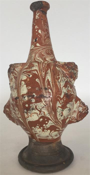 A Continental slipware flask with cream and brown