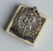 A high carat gold, enamel and diamond Regimental c