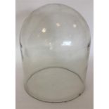 An unusual large glass dome. Approx. 37 cms high.