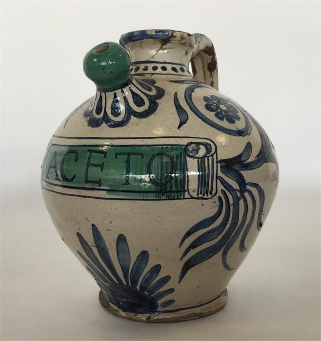 A Continental Maiolica oviform vinegar jar painted