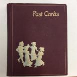 An old postcard album complete with numerous postc