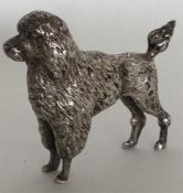 A cast silver figure of a Poodle in standing posit