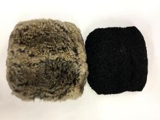 A fur muff together with one other. Est. £20 - £30