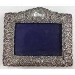 A good embossed silver picture frame decorated wit