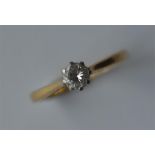 A small 18 carat single stone diamond ring with pl