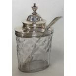 A silver mounted mustard pot with hinged top toget