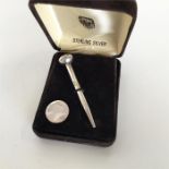 A novelty silver pencil in the form of a golf tee
