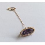 An amethyst pearl and boat shaped brooch in 15 car