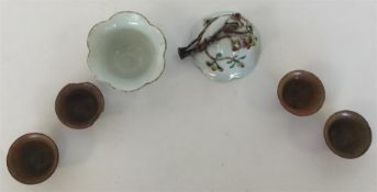 Four small brown-glazed pottery sake cups together