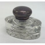 A small glass and silver hinged-top inkwell. London. Est. £50