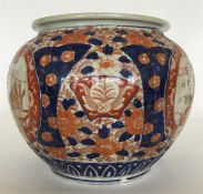 A large Imari-style bowl with floral decoration in