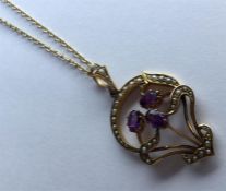 A heavy amethyst and pearl pendant in 15 carat on